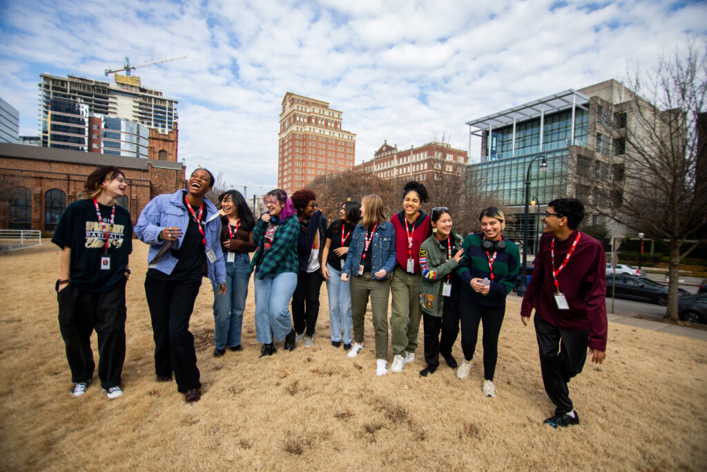 A group of teenagers walking and laughing