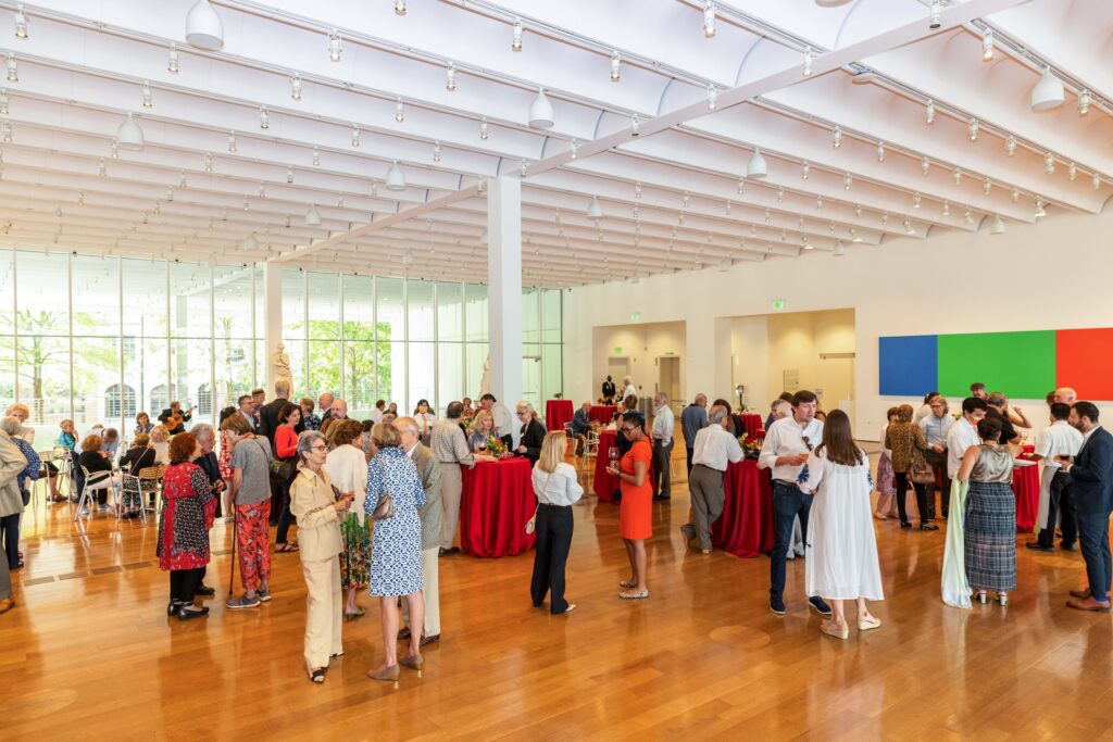 Catmax Photography High Museum Calder Picasso Circles 45 People standing and talking in a social gathering