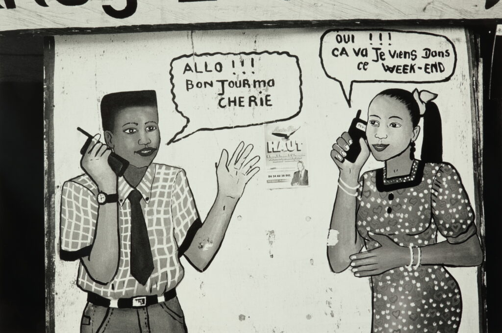 a young man and young woman speak into phones -- thought bubbles appear at their mouths - he says bonjour ma cherie, and she says 