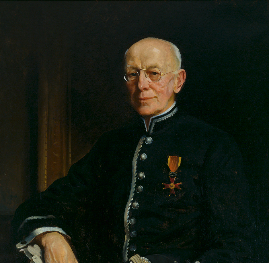 Portrait of a white, bald man wearing a black coat with silver buttons. His chest is decorated with an eight-pointed cross, the insignia of the Order of St. Gregory the Great.
